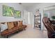 Comfortable living room featuring a brown couch, and bookshelf at 791 66Th S Ave, St Petersburg, FL 33705