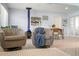 Cozy seating area with a blue freestanding fireplace and a view into the dining room, perfect for relaxation at 791 66Th S Ave, St Petersburg, FL 33705