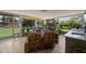 Inviting sunroom featuring seating, outdoor views, and a sink for convenience at 791 66Th S Ave, St Petersburg, FL 33705
