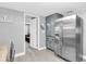 Galley kitchen featuring bright natural light and stainless steel refrigerator at 8108 E 19Th Ave, Tampa, FL 33619