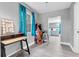 Bright living space leads to kitchen; features a vanity and an arcade game at 8108 E 19Th Ave, Tampa, FL 33619