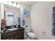 Charming half-bathroom with elegant granite countertops, soft lighting, and stylish decor at 8358 Dunham Station Dr, Tampa, FL 33647