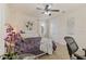 Comfortable bedroom with a ceiling fan, large windows, and neutral tones at 8358 Dunham Station Dr, Tampa, FL 33647