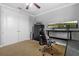 Office or bedroom with dual monitors, comfortable chair, and large closet with double doors at 8358 Dunham Station Dr, Tampa, FL 33647
