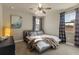 Cozy bedroom featuring neutral tones, a comfortable bed, and natural light from the window at 8358 Dunham Station Dr, Tampa, FL 33647