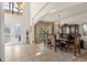 Formal dining room with elegant chandelier, furniture, and large windows at 8358 Dunham Station Dr, Tampa, FL 33647