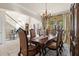 Dining room features an elegant table set and a chandelier at 8358 Dunham Station Dr, Tampa, FL 33647
