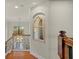 Bright foyer with hardwood floors, decorative railing, and a stunning arched window at 8358 Dunham Station Dr, Tampa, FL 33647