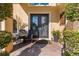 Elegant front entrance featuring double doors, a cozy seating area, and tasteful decor at 8358 Dunham Station Dr, Tampa, FL 33647
