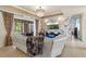 The living room has a TV, doors that open to the pool, and a marble accent wall at 8358 Dunham Station Dr, Tampa, FL 33647
