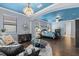 An open main bedroom features hardwood floors and a beautiful blue ceiling at 8358 Dunham Station Dr, Tampa, FL 33647