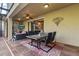 Inviting outdoor patio with a table, chairs, and comfortable seating, perfect for dining and relaxing at 8358 Dunham Station Dr, Tampa, FL 33647
