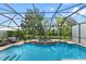 The screened pool and spa offer a refreshing escape amidst mature landscaping, blending luxury with nature at 8358 Dunham Station Dr, Tampa, FL 33647