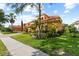 Lovely home with well-maintained lawn and landscaping, including a brick driveway at 8358 Dunham Station Dr, Tampa, FL 33647