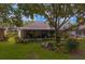 Landscaped backyard with a screened lanai, perfect for enjoying the outdoors at 8624 Snowy Owl Way, Tampa, FL 33647