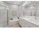 Bathroom features a walk-in shower, soaking tub, and double vanity at 8624 Snowy Owl Way, Tampa, FL 33647