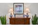 Elegant living room decor featuring lamps, artwork, and wooden furniture accents at 8624 Snowy Owl Way, Tampa, FL 33647