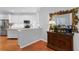 Spacious kitchen with white cabinets, stainless steel appliances, and wood accents at 8624 Snowy Owl Way, Tampa, FL 33647