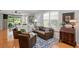 Inviting living room with hardwood floors, plush sofas, and abundant natural light at 8624 Snowy Owl Way, Tampa, FL 33647