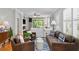 Bright living room with hardwood floors, comfortable seating, and natural light at 8624 Snowy Owl Way, Tampa, FL 33647