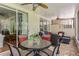 Relaxing screened-in patio with a dining table set and a seating area with comfortable outdoor furniture at 8624 Snowy Owl Way, Tampa, FL 33647
