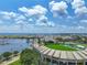 Aerial view showcasing the city skyline, stadium, and waterfront with sunny skies at 1 Beach Se Dr # 811, St Petersburg, FL 33701