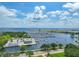 An aerial view of a marina, waterfront, and buildings with ocean view and cloudy skies at 1 Beach Se Dr # 811, St Petersburg, FL 33701