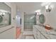 Bright bathroom with granite countertops, double sinks and walk-in shower at 1 Beach Se Dr # 811, St Petersburg, FL 33701