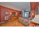 Cozy bedroom with wood floors, dresser, and view of the city at 1 Beach Se Dr # 811, St Petersburg, FL 33701