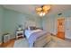 Bright bedroom with a ceiling fan, ensuite bathroom and hardwood flooring at 1 Beach Se Dr # 811, St Petersburg, FL 33701
