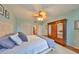 Bright bedroom with a large wooden wardrobe, ceiling fan and ensuite bathroom at 1 Beach Se Dr # 811, St Petersburg, FL 33701
