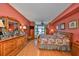 Bedroom featuring wood floors and dresser and large windows at 1 Beach Se Dr # 811, St Petersburg, FL 33701