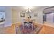 Open dining room with wood flooring and natural light featuring a table and seating for four at 1 Beach Se Dr # 811, St Petersburg, FL 33701