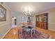 Dining room with wood flooring, antique cabinet, and dining table for four, with connecting room at 1 Beach Se Dr # 811, St Petersburg, FL 33701