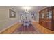 Dining room with wood flooring, large antique cabinet, and dining table for four at 1 Beach Se Dr # 811, St Petersburg, FL 33701