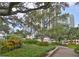 Beautifully landscaped exterior with lush green hedges, mature trees, and walkways in a well-maintained community at 1 Beach Se Dr # 811, St Petersburg, FL 33701