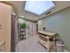 Bright kitchen features a skylight, stainless steel appliances, and tile flooring at 1 Beach Se Dr # 811, St Petersburg, FL 33701