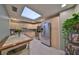 Bright kitchen featuring stainless steel appliances, ample cabinet space, and a skylight at 1 Beach Se Dr # 811, St Petersburg, FL 33701