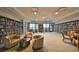 Extensive library with floor-to-ceiling bookshelves, cozy seating areas, and tables for quiet study and reflection at 1 Beach Se Dr # 811, St Petersburg, FL 33701