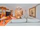 Spacious living room leading to formal dining area featuring comfortable sofa and hardwood floors at 1 Beach Se Dr # 811, St Petersburg, FL 33701