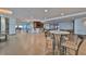 Well-lit lounge area with bar seating, tables, and a relaxed, inviting atmosphere for residents at 1 Beach Se Dr # 811, St Petersburg, FL 33701
