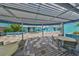 Patio with tables, chairs, and barbecue grill at 1 Beach Se Dr # 811, St Petersburg, FL 33701