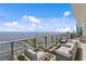 Wide balcony area with stylish seating that overlooks water and city views at 100 1St N Ave # 3905, St Petersburg, FL 33701