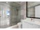 Modern bathroom featuring white marble, glass shower, and gold hardware at 100 1St N Ave # 3905, St Petersburg, FL 33701