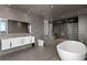 Sleek, modern bathroom with double vanity, glass shower, and standalone tub at 100 1St N Ave # 3905, St Petersburg, FL 33701