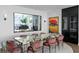 Dining room with unique dining table and chairs with modern art pieces at 100 1St N Ave # 3905, St Petersburg, FL 33701