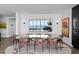 Dining room with unique dining table and chairs and sweeping water views at 100 1St N Ave # 3905, St Petersburg, FL 33701