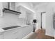 Modern kitchen featuring sleek white cabinetry, stainless steel appliances, and an induction cooktop at 100 1St N Ave # 3905, St Petersburg, FL 33701