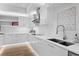 Modern white kitchen with stainless steel appliances, stylish countertops, and ample cabinet space at 100 1St N Ave # 3905, St Petersburg, FL 33701