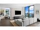 Contemporary living room with a large TV, comfortable seating, and a scenic ocean view at 100 1St N Ave # 3905, St Petersburg, FL 33701